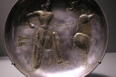 Photo of Sassanid Empire's Coins,Mosaics,Silver relief,Jewelry and seals,Pottery and stucco sculpture&Textiles. The Exhibition entitled Les Perses Sassanides, Fastes d'un Empire Oublié exhibits at the Cernuschi, Museum Paris.More than 200 items are presented at the exhibition and borrowed from the most prestigious international collections from museums in the United States, Europe and Iran testify of the diversity of this sumptuous art and of its various influences combining ancient Greek and authentic Persian traditions.The Kings court was equally sumptuous with grand parties given for princes and nobles of allied kingdoms. This ostentatious splendor encourages more "minor" arts. Silver dishes encrusted by gold coins featuring the King, Cups and Amphora's decorated by symbols related to Mazdean religion ( Pre-Islamic monotheistic religion) or shows dancers, musicians and jesters. Fine Crockery, rich silk, ceremonial jewel encrusted swords and gold or silver coins are displayed at the exhibition.