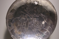 Photo of Sassanid Empire's Coins,Mosaics,Silver relief,Jewelry and seals,Pottery and stucco sculpture&Textiles. The Exhibition entitled Les Perses Sassanides, Fastes d'un Empire Oublié exhibits at the Cernuschi, Museum Paris.More than 200 items are presented at the exhibition and borrowed from the most prestigious international collections from museums in the United States, Europe and Iran testify of the diversity of this sumptuous art and of its various influences combining ancient Greek and authentic Persian traditions.The Kings court was equally sumptuous with grand parties given for princes and nobles of allied kingdoms. This ostentatious splendor encourages more "minor" arts. Silver dishes encrusted by gold coins featuring the King, Cups and Amphora's decorated by symbols related to Mazdean religion ( Pre-Islamic monotheistic religion) or shows dancers, musicians and jesters. Fine Crockery, rich silk, ceremonial jewel encrusted swords and gold or silver coins are displayed at the exhibition.