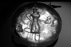 Photo of Sassanid Empire's Coins,Mosaics,Silver relief,Jewelry and seals,Pottery and stucco sculpture&Textiles. The Exhibition entitled Les Perses Sassanides, Fastes d'un Empire Oublié exhibits at the Cernuschi, Museum Paris.More than 200 items are presented at the exhibition and borrowed from the most prestigious international collections from museums in the United States, Europe and Iran testify of the diversity of this sumptuous art and of its various influences combining ancient Greek and authentic Persian traditions.The Kings court was equally sumptuous with grand parties given for princes and nobles of allied kingdoms. This ostentatious splendor encourages more "minor" arts. Silver dishes encrusted by gold coins featuring the King, Cups and Amphora's decorated by symbols related to Mazdean religion ( Pre-Islamic monotheistic religion) or shows dancers, musicians and jesters. Fine Crockery, rich silk, ceremonial jewel encrusted swords and gold or silver coins are displayed at the exhibition.