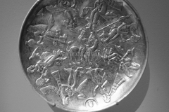 Photo of Sassanid Empire's Coins,Mosaics,Silver relief,Jewelry and seals,Pottery and stucco sculpture&Textiles. The Exhibition entitled Les Perses Sassanides, Fastes d'un Empire Oublié exhibits at the Cernuschi, Museum Paris.More than 200 items are presented at the exhibition and borrowed from the most prestigious international collections from museums in the United States, Europe and Iran testify of the diversity of this sumptuous art and of its various influences combining ancient Greek and authentic Persian traditions.The Kings court was equally sumptuous with grand parties given for princes and nobles of allied kingdoms. This ostentatious splendor encourages more "minor" arts. Silver dishes encrusted by gold coins featuring the King, Cups and Amphora's decorated by symbols related to Mazdean religion ( Pre-Islamic monotheistic religion) or shows dancers, musicians and jesters. Fine Crockery, rich silk, ceremonial jewel encrusted swords and gold or silver coins are displayed at the exhibition.