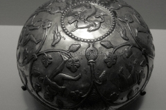Photo of Sassanid Empire's Coins,Mosaics,Silver relief,Jewelry and seals,Pottery and stucco sculpture&Textiles. The Exhibition entitled Les Perses Sassanides, Fastes d'un Empire Oublié exhibits at the Cernuschi, Museum Paris.More than 200 items are presented at the exhibition and borrowed from the most prestigious international collections from museums in the United States, Europe and Iran testify of the diversity of this sumptuous art and of its various influences combining ancient Greek and authentic Persian traditions.The Kings court was equally sumptuous with grand parties given for princes and nobles of allied kingdoms. This ostentatious splendor encourages more "minor" arts. Silver dishes encrusted by gold coins featuring the King, Cups and Amphora's decorated by symbols related to Mazdean religion ( Pre-Islamic monotheistic religion) or shows dancers, musicians and jesters. Fine Crockery, rich silk, ceremonial jewel encrusted swords and gold or silver coins are displayed at the exhibition.
