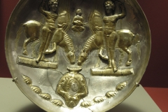 Photo of Sassanid Empire's Coins,Mosaics,Silver relief,Jewelry and seals,Pottery and stucco sculpture&Textiles. The Exhibition entitled Les Perses Sassanides, Fastes d'un Empire Oublié exhibits at the Cernuschi, Museum Paris.More than 200 items are presented at the exhibition and borrowed from the most prestigious international collections from museums in the United States, Europe and Iran testify of the diversity of this sumptuous art and of its various influences combining ancient Greek and authentic Persian traditions.The Kings court was equally sumptuous with grand parties given for princes and nobles of allied kingdoms. This ostentatious splendor encourages more "minor" arts. Silver dishes encrusted by gold coins featuring the King, Cups and Amphora's decorated by symbols related to Mazdean religion ( Pre-Islamic monotheistic religion) or shows dancers, musicians and jesters. Fine Crockery, rich silk, ceremonial jewel encrusted swords and gold or silver coins are displayed at the exhibition.