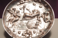 Photo of Sassanid Empire's Coins,Mosaics,Silver relief,Jewelry and seals,Pottery and stucco sculpture&Textiles. The Exhibition entitled Les Perses Sassanides, Fastes d'un Empire Oublié exhibits at the Cernuschi, Museum Paris.More than 200 items are presented at the exhibition and borrowed from the most prestigious international collections from museums in the United States, Europe and Iran testify of the diversity of this sumptuous art and of its various influences combining ancient Greek and authentic Persian traditions.The Kings court was equally sumptuous with grand parties given for princes and nobles of allied kingdoms. This ostentatious splendor encourages more "minor" arts. Silver dishes encrusted by gold coins featuring the King, Cups and Amphora's decorated by symbols related to Mazdean religion ( Pre-Islamic monotheistic religion) or shows dancers, musicians and jesters. Fine Crockery, rich silk, ceremonial jewel encrusted swords and gold or silver coins are displayed at the exhibition.