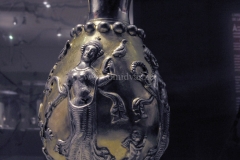 Photo of Sassanid Empire's Coins,Mosaics,Silver relief,Jewelry and seals,Pottery and stucco sculpture&Textiles. The Exhibition entitled Les Perses Sassanides, Fastes d'un Empire Oublié exhibits at the Cernuschi, Museum Paris.More than 200 items are presented at the exhibition and borrowed from the most prestigious international collections from museums in the United States, Europe and Iran testify of the diversity of this sumptuous art and of its various influences combining ancient Greek and authentic Persian traditions.The Kings court was equally sumptuous with grand parties given for princes and nobles of allied kingdoms. This ostentatious splendor encourages more "minor" arts. Silver dishes encrusted by gold coins featuring the King, Cups and Amphora's decorated by symbols related to Mazdean religion ( Pre-Islamic monotheistic religion) or shows dancers, musicians and jesters. Fine Crockery, rich silk, ceremonial jewel encrusted swords and gold or silver coins are displayed at the exhibition.