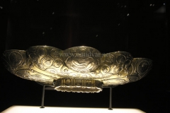Photo of Sassanid Empire's Coins,Mosaics,Silver relief,Jewelry and seals,Pottery and stucco sculpture&Textiles. The Exhibition entitled Les Perses Sassanides, Fastes d'un Empire Oublié exhibits at the Cernuschi, Museum Paris.More than 200 items are presented at the exhibition and borrowed from the most prestigious international collections from museums in the United States, Europe and Iran testify of the diversity of this sumptuous art and of its various influences combining ancient Greek and authentic Persian traditions.The Kings court was equally sumptuous with grand parties given for princes and nobles of allied kingdoms. This ostentatious splendor encourages more "minor" arts. Silver dishes encrusted by gold coins featuring the King, Cups and Amphora's decorated by symbols related to Mazdean religion ( Pre-Islamic monotheistic religion) or shows dancers, musicians and jesters. Fine Crockery, rich silk, ceremonial jewel encrusted swords and gold or silver coins are displayed at the exhibition.