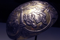Photo of Sassanid Empire's Coins,Mosaics,Silver relief,Jewelry and seals,Pottery and stucco sculpture&Textiles. The Exhibition entitled Les Perses Sassanides, Fastes d'un Empire Oublié exhibits at the Cernuschi, Museum Paris.More than 200 items are presented at the exhibition and borrowed from the most prestigious international collections from museums in the United States, Europe and Iran testify of the diversity of this sumptuous art and of its various influences combining ancient Greek and authentic Persian traditions.The Kings court was equally sumptuous with grand parties given for princes and nobles of allied kingdoms. This ostentatious splendor encourages more "minor" arts. Silver dishes encrusted by gold coins featuring the King, Cups and Amphora's decorated by symbols related to Mazdean religion ( Pre-Islamic monotheistic religion) or shows dancers, musicians and jesters. Fine Crockery, rich silk, ceremonial jewel encrusted swords and gold or silver coins are displayed at the exhibition.