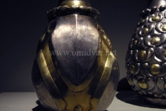 Photo of Sassanid Empire's Coins,Mosaics,Silver relief,Jewelry and seals,Pottery and stucco sculpture&Textiles. The Exhibition entitled Les Perses Sassanides, Fastes d'un Empire Oublié exhibits at the Cernuschi, Museum Paris.More than 200 items are presented at the exhibition and borrowed from the most prestigious international collections from museums in the United States, Europe and Iran testify of the diversity of this sumptuous art and of its various influences combining ancient Greek and authentic Persian traditions.The Kings court was equally sumptuous with grand parties given for princes and nobles of allied kingdoms. This ostentatious splendor encourages more "minor" arts. Silver dishes encrusted by gold coins featuring the King, Cups and Amphora's decorated by symbols related to Mazdean religion ( Pre-Islamic monotheistic religion) or shows dancers, musicians and jesters. Fine Crockery, rich silk, ceremonial jewel encrusted swords and gold or silver coins are displayed at the exhibition.