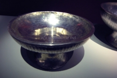Photo of Sassanid Empire's Coins,Mosaics,Silver relief,Jewelry and seals,Pottery and stucco sculpture&Textiles. The Exhibition entitled Les Perses Sassanides, Fastes d'un Empire Oublié exhibits at the Cernuschi, Museum Paris.More than 200 items are presented at the exhibition and borrowed from the most prestigious international collections from museums in the United States, Europe and Iran testify of the diversity of this sumptuous art and of its various influences combining ancient Greek and authentic Persian traditions.The Kings court was equally sumptuous with grand parties given for princes and nobles of allied kingdoms. This ostentatious splendor encourages more "minor" arts. Silver dishes encrusted by gold coins featuring the King, Cups and Amphora's decorated by symbols related to Mazdean religion ( Pre-Islamic monotheistic religion) or shows dancers, musicians and jesters. Fine Crockery, rich silk, ceremonial jewel encrusted swords and gold or silver coins are displayed at the exhibition.