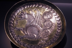 Photo of Sassanid Empire's Coins,Mosaics,Silver relief,Jewelry and seals,Pottery and stucco sculpture&Textiles. The Exhibition entitled Les Perses Sassanides, Fastes d'un Empire Oublié exhibits at the Cernuschi, Museum Paris.More than 200 items are presented at the exhibition and borrowed from the most prestigious international collections from museums in the United States, Europe and Iran testify of the diversity of this sumptuous art and of its various influences combining ancient Greek and authentic Persian traditions.The Kings court was equally sumptuous with grand parties given for princes and nobles of allied kingdoms. This ostentatious splendor encourages more "minor" arts. Silver dishes encrusted by gold coins featuring the King, Cups and Amphora's decorated by symbols related to Mazdean religion ( Pre-Islamic monotheistic religion) or shows dancers, musicians and jesters. Fine Crockery, rich silk, ceremonial jewel encrusted swords and gold or silver coins are displayed at the exhibition.
