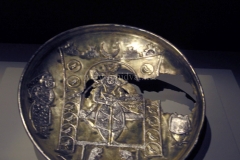 Photo of Sassanid Empire's Coins,Mosaics,Silver relief,Jewelry and seals,Pottery and stucco sculpture&Textiles. The Exhibition entitled Les Perses Sassanides, Fastes d'un Empire Oublié exhibits at the Cernuschi, Museum Paris.More than 200 items are presented at the exhibition and borrowed from the most prestigious international collections from museums in the United States, Europe and Iran testify of the diversity of this sumptuous art and of its various influences combining ancient Greek and authentic Persian traditions.The Kings court was equally sumptuous with grand parties given for princes and nobles of allied kingdoms. This ostentatious splendor encourages more "minor" arts. Silver dishes encrusted by gold coins featuring the King, Cups and Amphora's decorated by symbols related to Mazdean religion ( Pre-Islamic monotheistic religion) or shows dancers, musicians and jesters. Fine Crockery, rich silk, ceremonial jewel encrusted swords and gold or silver coins are displayed at the exhibition.
