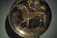 Photo of Sassanid Empire's Coins,Mosaics,Silver relief,Jewelry and seals,Pottery and stucco sculpture&Textiles. The Exhibition entitled Les Perses Sassanides, Fastes d'un Empire Oublié exhibits at the Cernuschi, Museum Paris.More than 200 items are presented at the exhibition and borrowed from the most prestigious international collections from museums in the United States, Europe and Iran testify of the diversity of this sumptuous art and of its various influences combining ancient Greek and authentic Persian traditions.The Kings court was equally sumptuous with grand parties given for princes and nobles of allied kingdoms. This ostentatious splendor encourages more "minor" arts. Silver dishes encrusted by gold coins featuring the King, Cups and Amphora's decorated by symbols related to Mazdean religion ( Pre-Islamic monotheistic religion) or shows dancers, musicians and jesters. Fine Crockery, rich silk, ceremonial jewel encrusted swords and gold or silver coins are displayed at the exhibition.